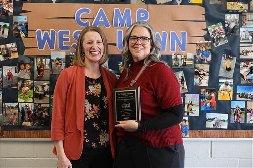 Dr. Mintken posing with her award